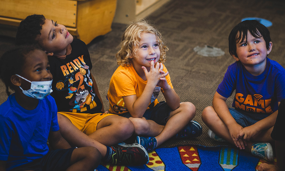 Kids smiling in a classroom